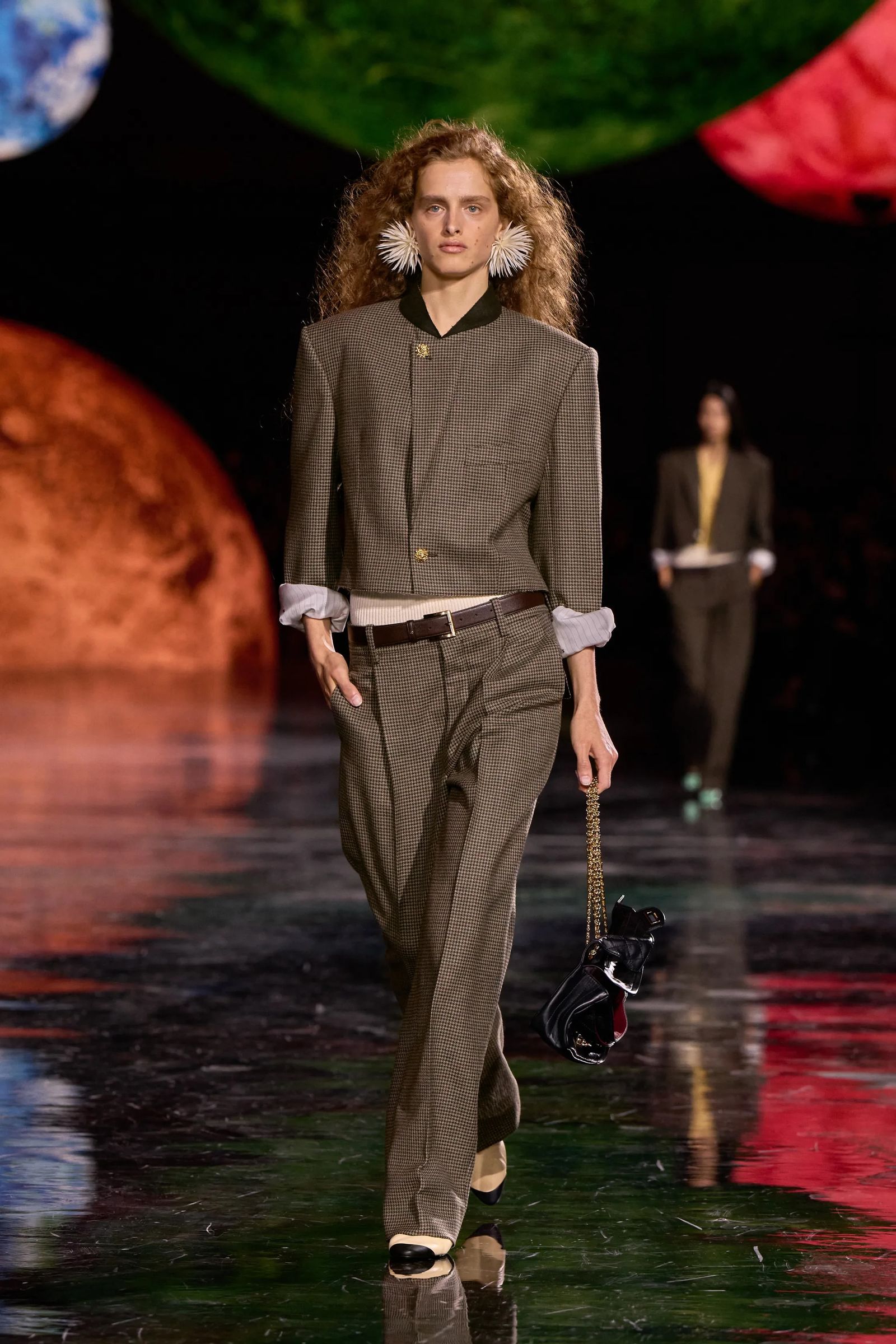 Image may contain Clothing Formal Wear Suit Fashion Adult Person Accessories Belt and Coat