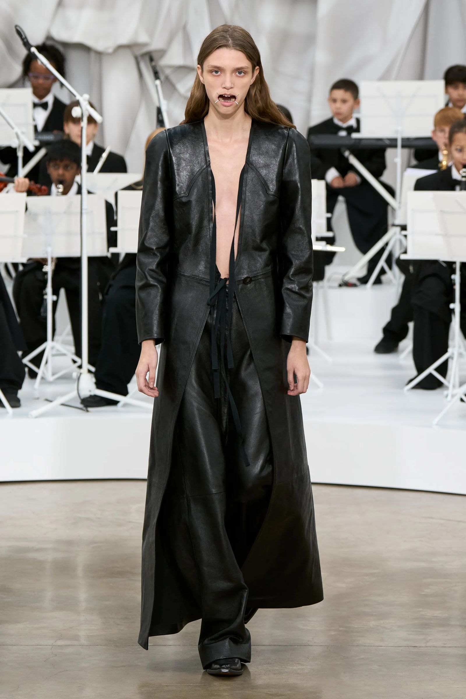 Image may contain Varun Aaron Clothing Coat Child Person Accessories Formal Wear Tie Adult Footwear and Shoe