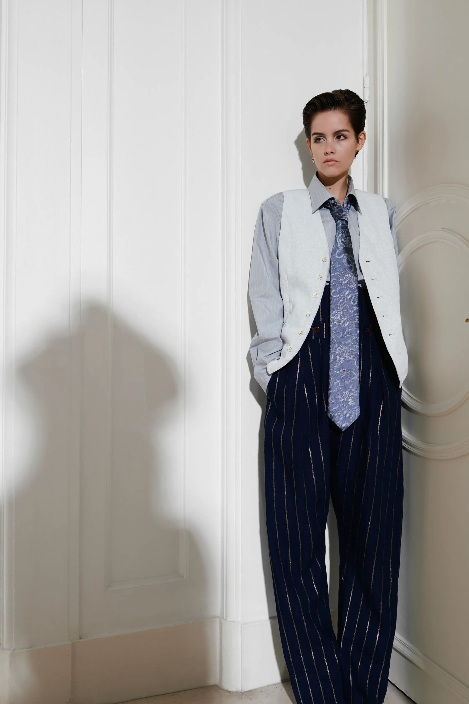 Image may contain Clothing Formal Wear Suit Shirt Accessories Tie Pants Adult Person Dress Shirt Blazer and Coat