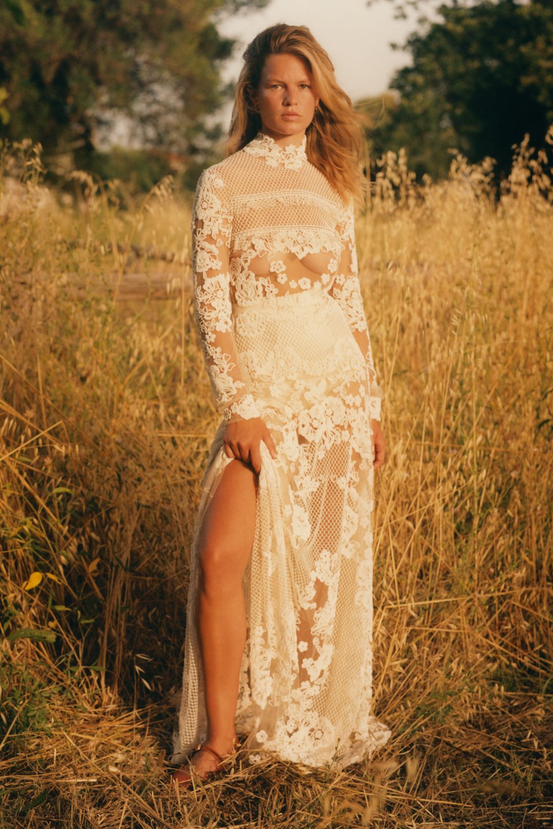 Image may contain Anna Ewers Clothing Dress Fashion Formal Wear Gown Wedding Wedding Gown Adult and Person