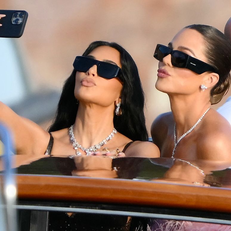 Image may contain: Khloé Kardashian, Kim Kardashian, Face, Head, Person, Selfie, Accessories, Sunglasses, and Jewelry. TOPSHOT - US reality TV personality Kim Kardashian (L) and US socialite Khloe Kardashian snap a selfie as they arrive at San Giorgio Maggiore on the wedding day of Amazon founder Jeff Bezos with Lauren Sanchez, in Venice on June 27, 2025. (Photo by Marco BERTORELLO / AFP) (Photo by MARCO BERTORELLO/AFP via Getty Images)