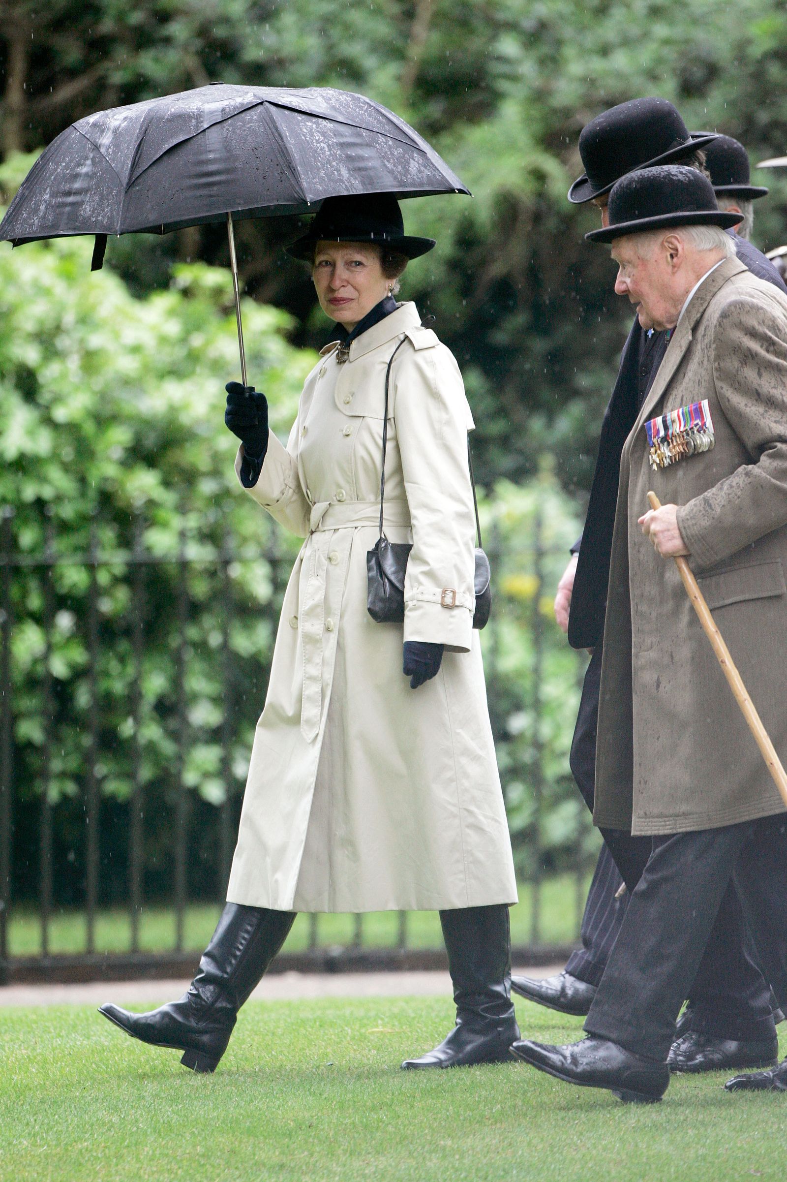 Image may contain Niki Lauda Anne Princess Royal Person Clothing Coat Adult Glove Accessories Bag and Handbag. LONDON...