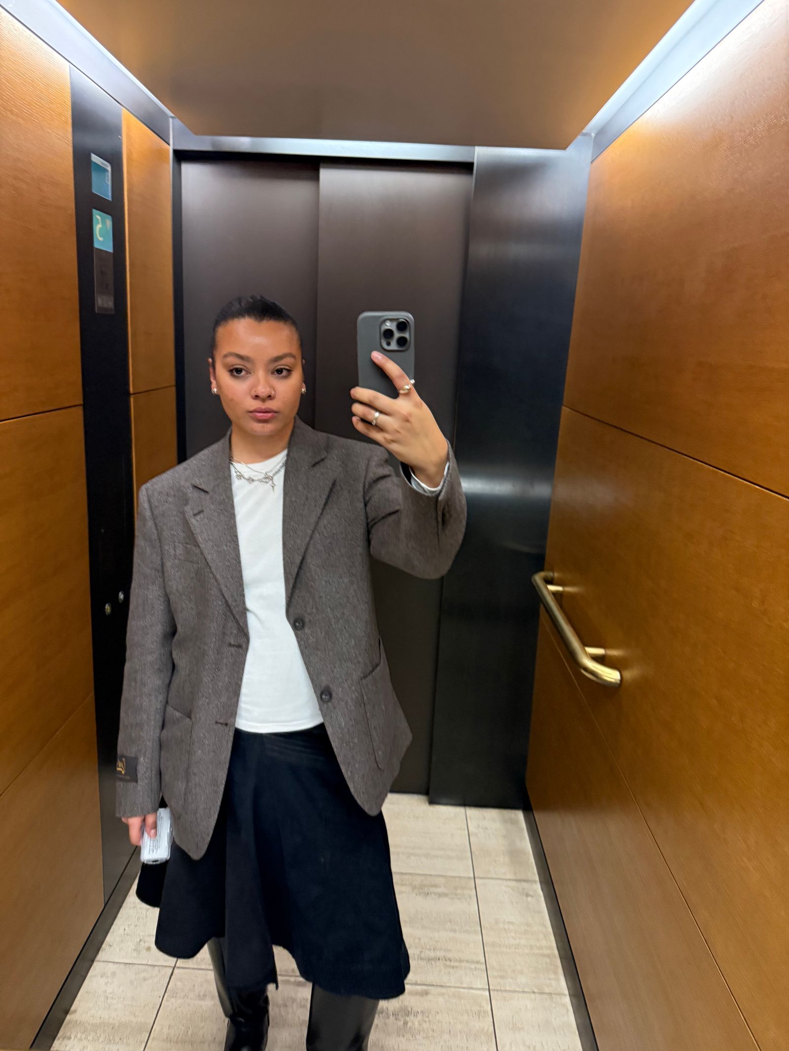 Image may contain Wesley Klein Indoors Blazer Clothing Coat Jacket Elevator Adult and Person