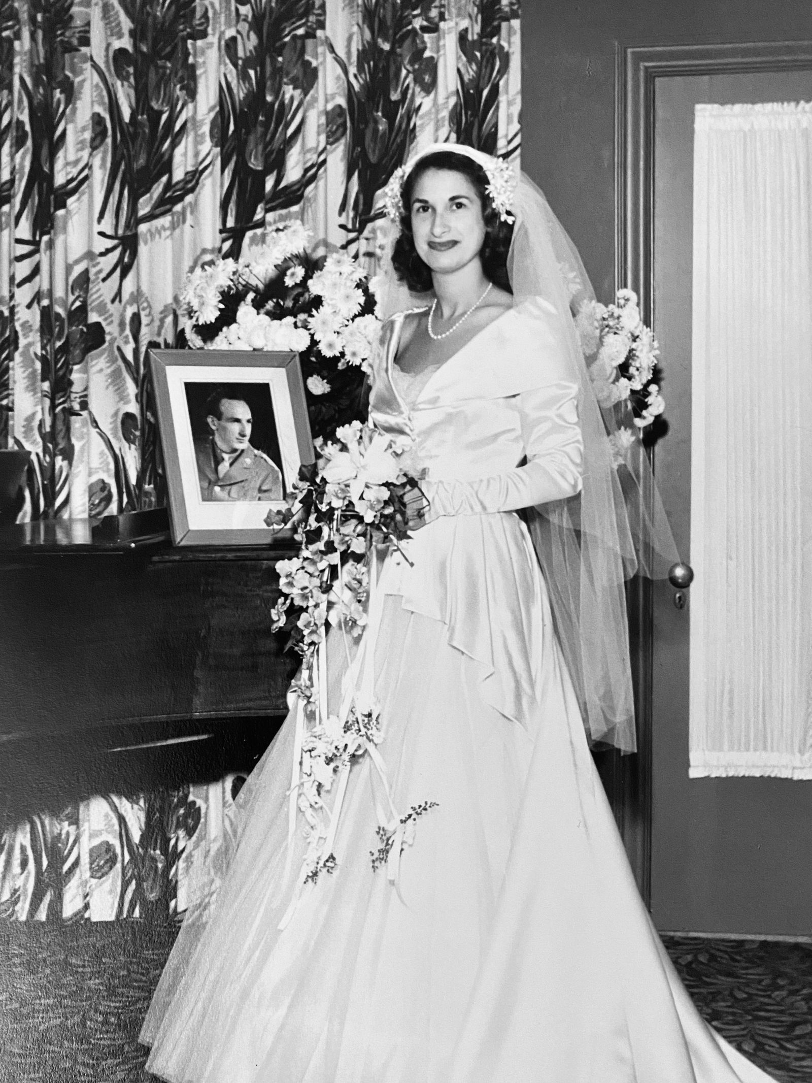 Image may contain Eric de Kuyper Clothing Dress Fashion Formal Wear Gown Wedding Wedding Gown and Flower