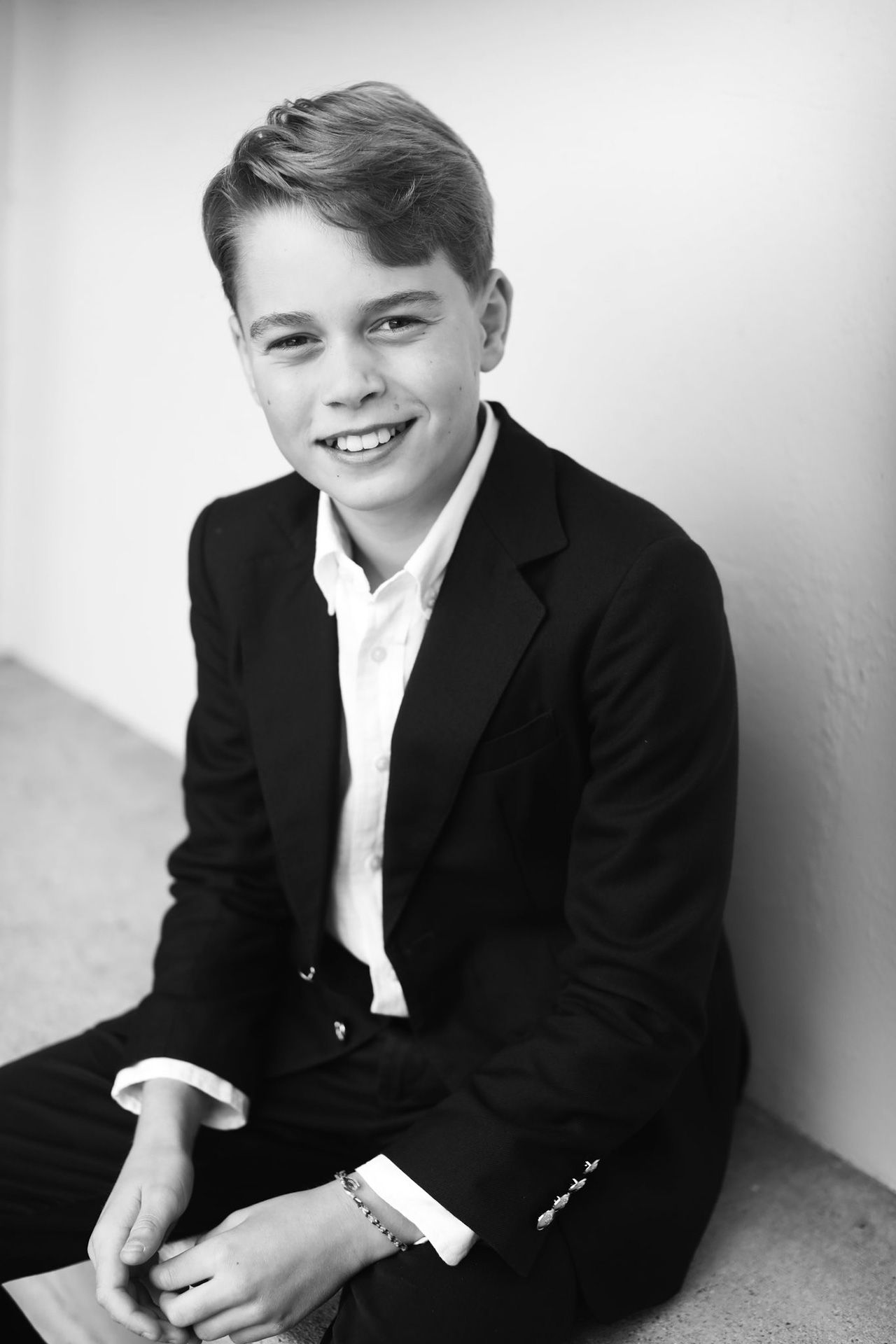 Image may contain Prince George of Cambridge Clothing Formal Wear Suit Face Happy Head Person Smile and Photography