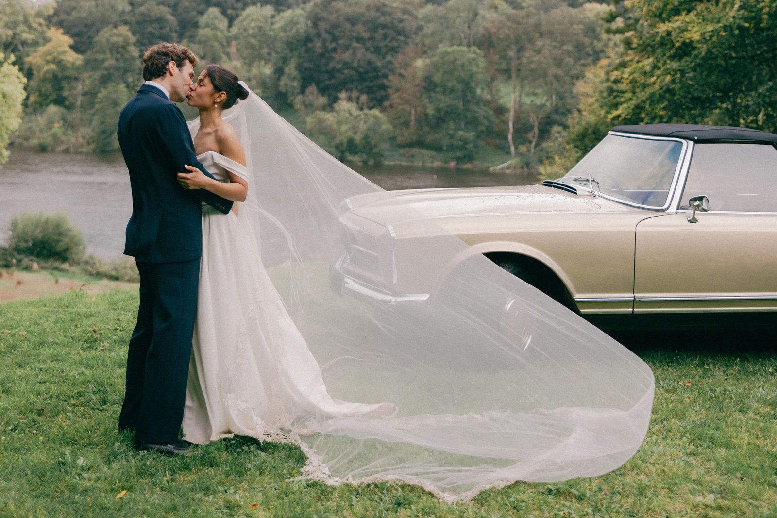 Image may contain: Clothing, Dress, Fashion, Formal Wear, Gown, Wedding, Wedding Gown, Grass, Plant, Face, Head, and Person