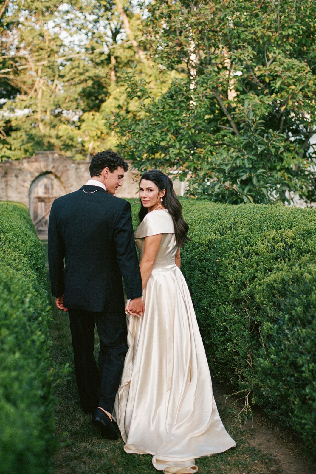 Image may contain Clothing Formal Wear Suit Blazer Coat Jacket Dress Fashion Gown Wedding Wedding Gown and Adult