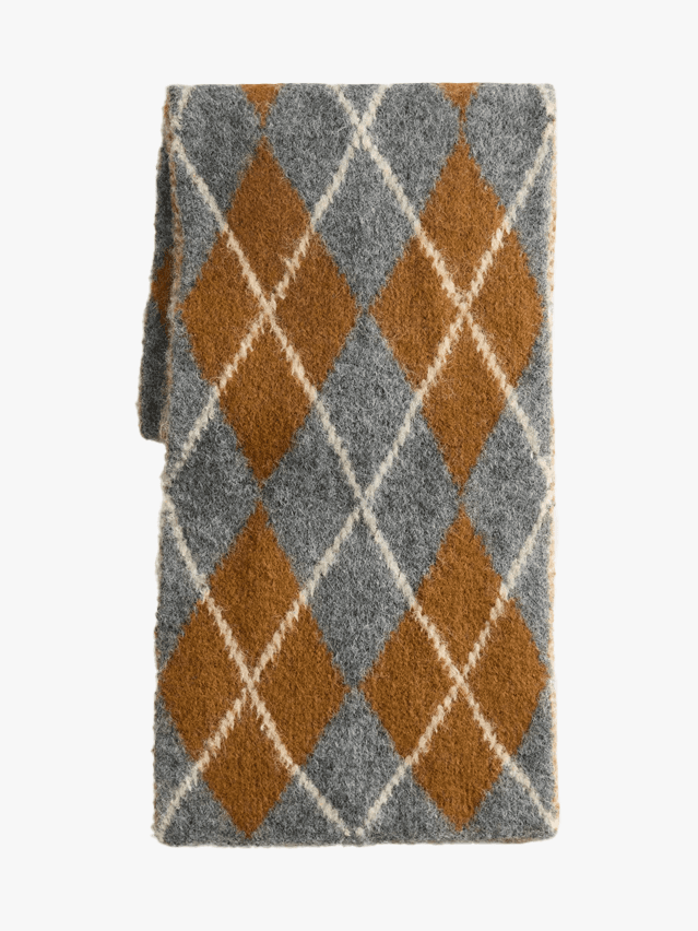 Image may contain Home Decor Rug Accessories Formal Wear and Tie