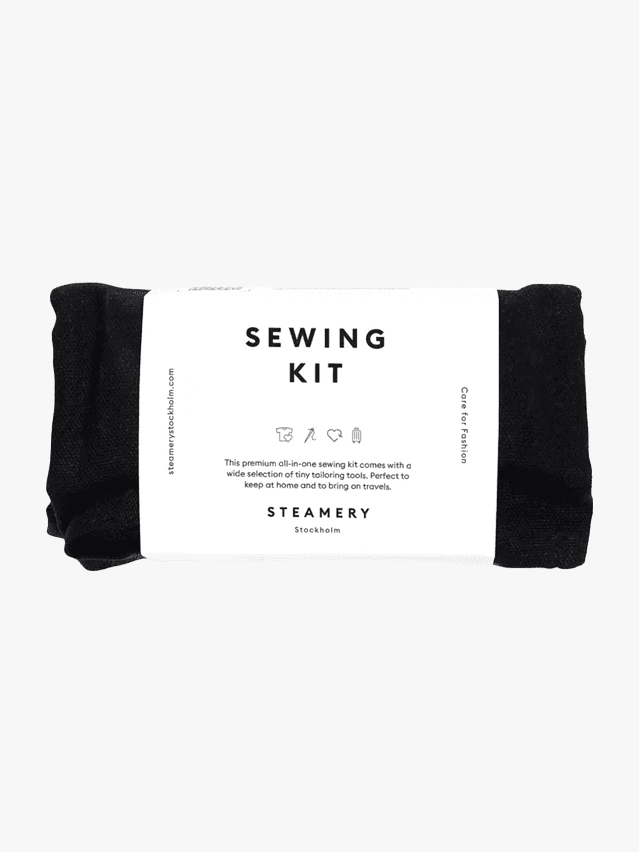 Image may contain: Cushion, Home Decor, Business Card, Paper, and Text